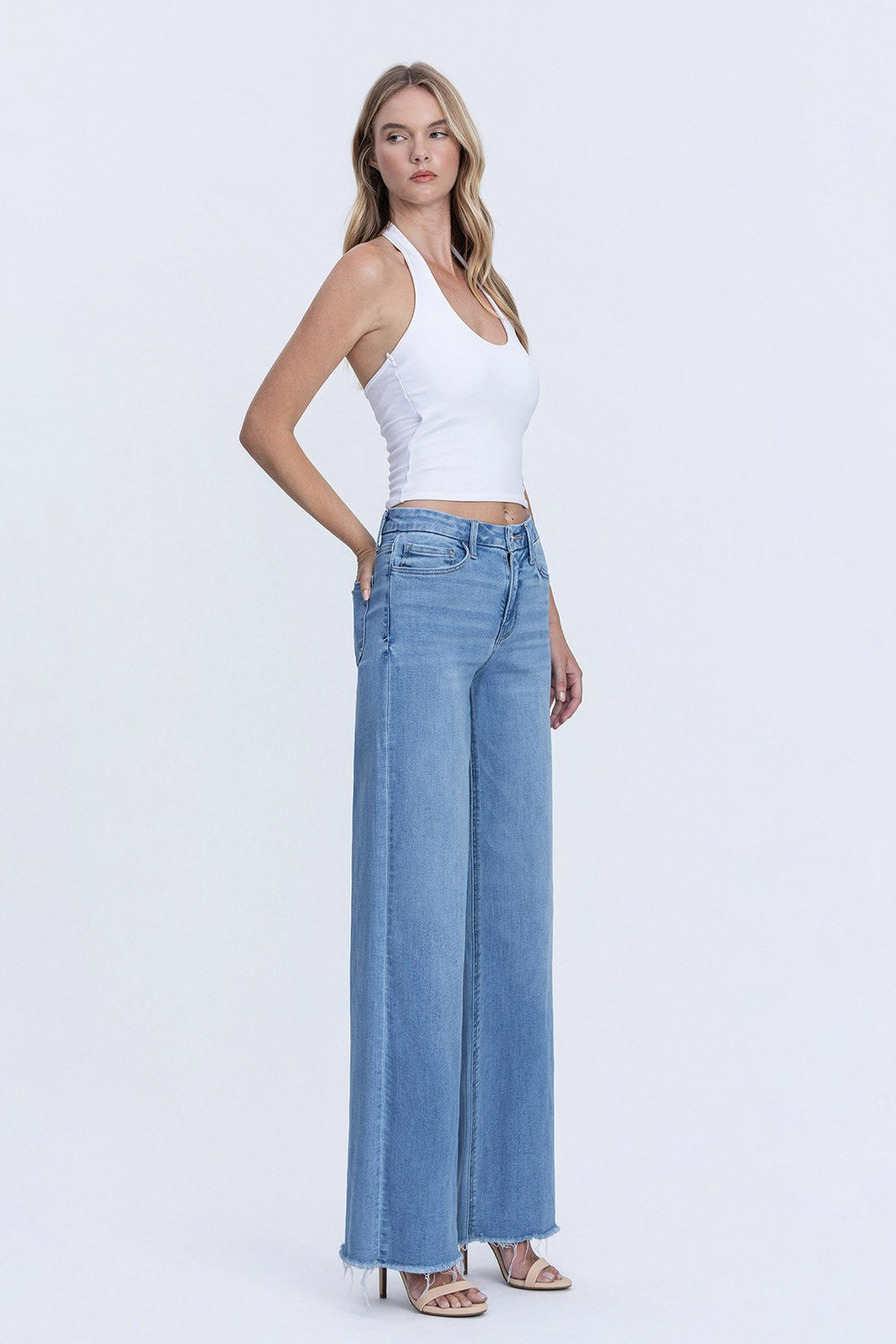 High Rise Medium Wash Frayed Hem Wide Leg Jeans